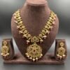 Antique necklace set with red, green, and white stones