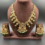 Gold-toned peacock antique necklace with red, green stones and pearls