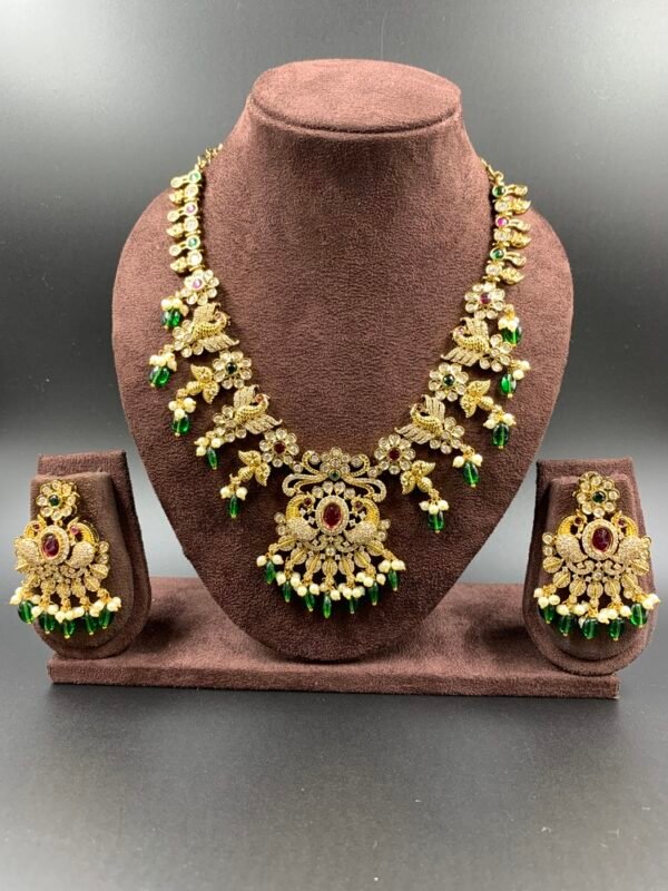 Gold-toned peacock antique necklace with red, green stones and pearls