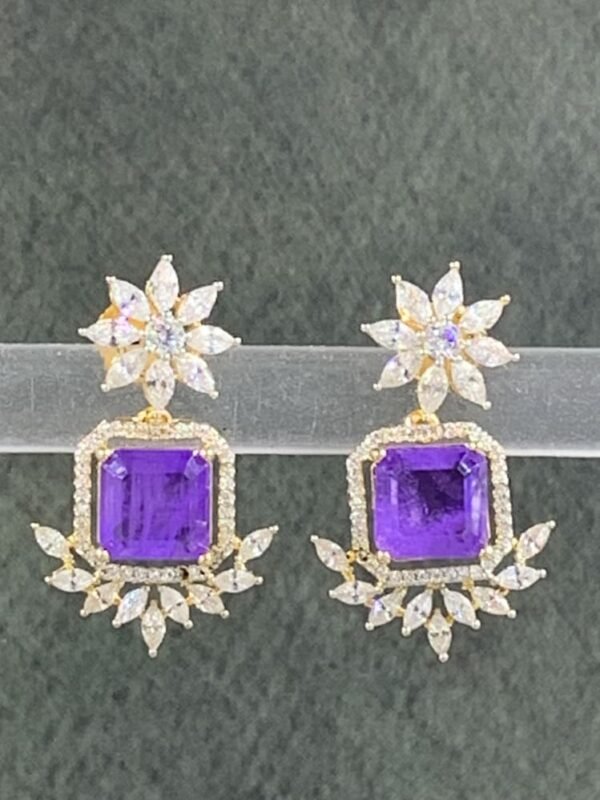 Purple stone earrings with floral gold-toned design
