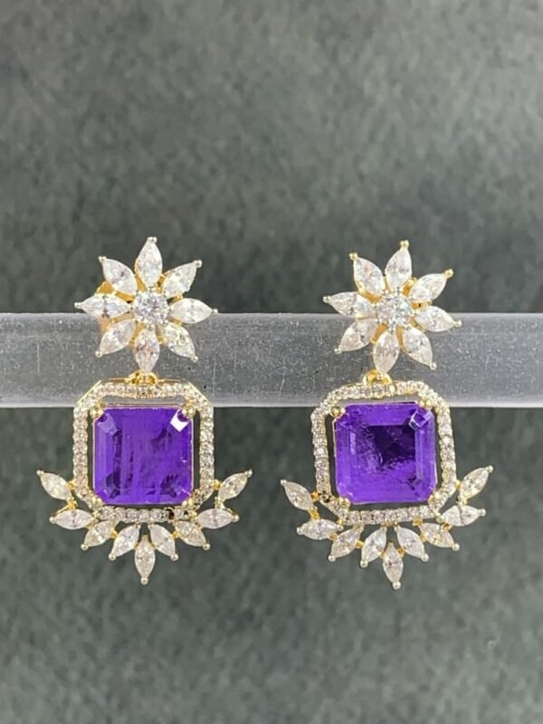 Purple stone earrings with floral gold-toned design