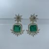green stone earrings with floral gold-toned design