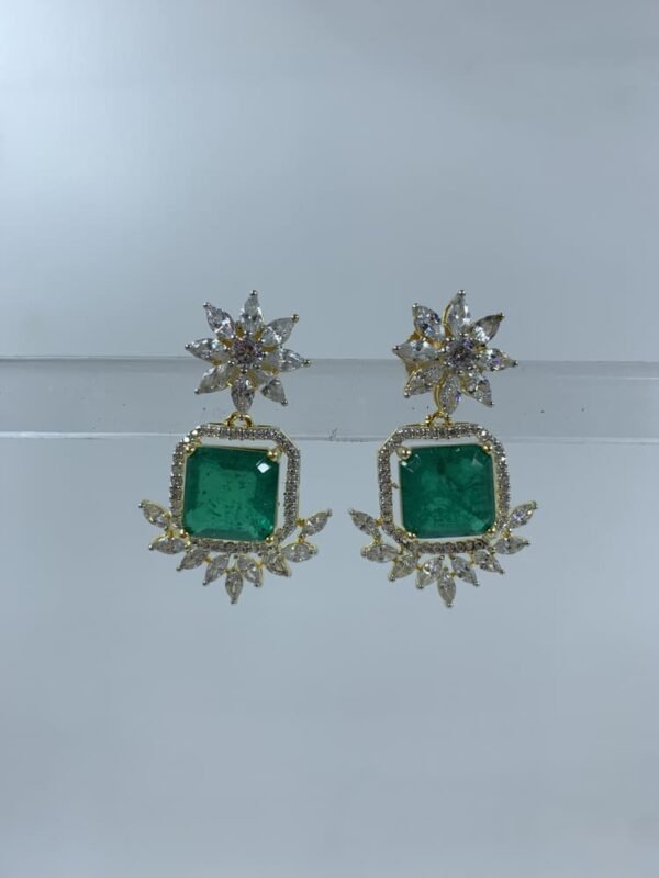 green stone earrings with floral gold-toned design