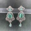 Elegant dangle earrings with aquamarine stones and cubic zirconia in ornate silver setting