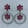 Elegant floral hoop earrings with fuchsia flower motifs and sparkling crystal accents in silver setting