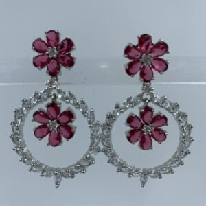 Elegant floral hoop earrings with fuchsia flower motifs and sparkling crystal accents in silver setting