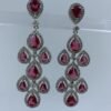 Elegant chandelier earrings with cascading fuchsia pear-shaped gemstones and crystal halo settings