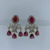 Elegant diamond earrings with chandelier design featuring oval gemstones and dangling teardrops