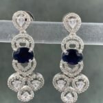 Blue stone earrings with silver-toned metal and white teardrop stones