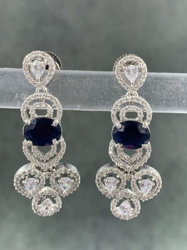 Blue stone earrings with silver-toned metal and white teardrop stones