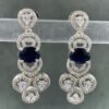 Blue stone earrings with silver-toned metal and white teardrop stones