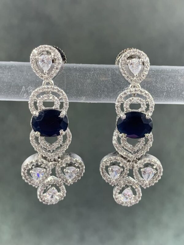 Blue stone earrings with silver-toned metal and white teardrop stones