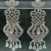 Ornate pink chandelier earrings with floral design and teardrop stones