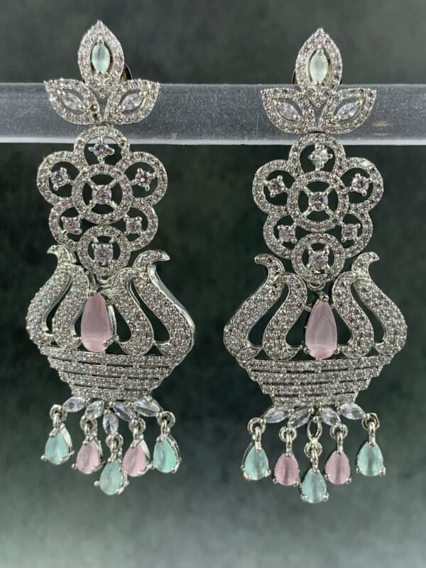 Ornate pink chandelier earrings with floral design and teardrop stones