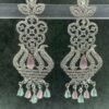 Ornate mint green chandelier earrings with floral design and teardrop stones