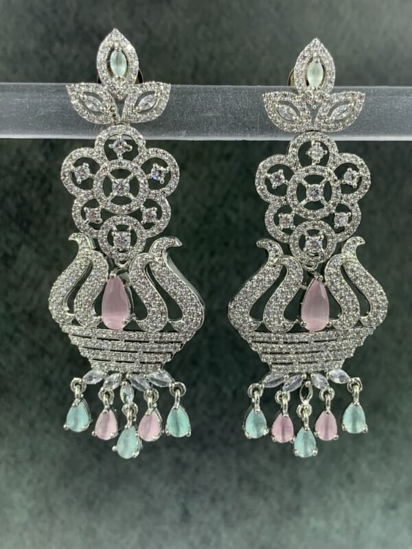 Ornate mint green chandelier earrings with floral design and teardrop stones