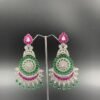 Intricate silver-toned chandbali earrings with rani and green gemstones