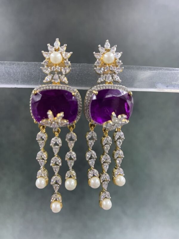 Statement drop earrings with pearl drops, purple gemstone, and floral stud
