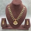 Traditional necklace with green stones, floral pendant, and pearl drops