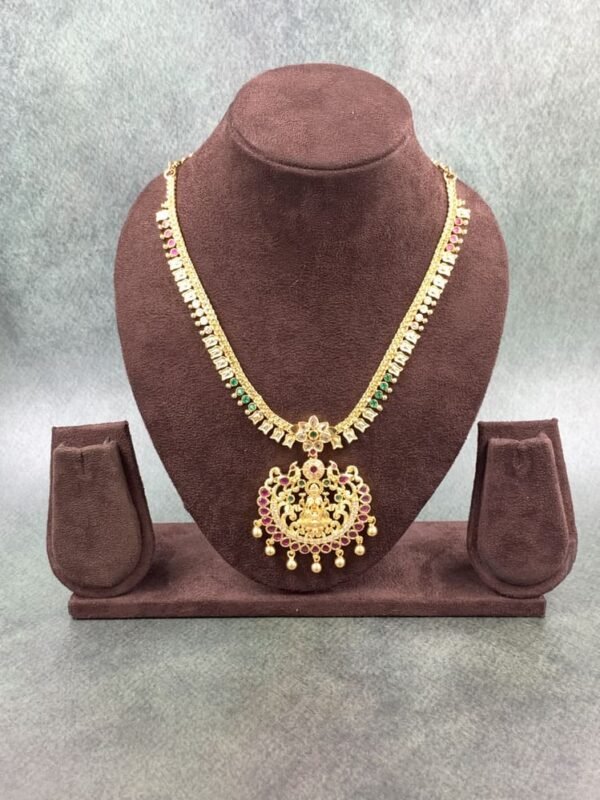 South Indian temple necklace featuring deity pendant with gold beads