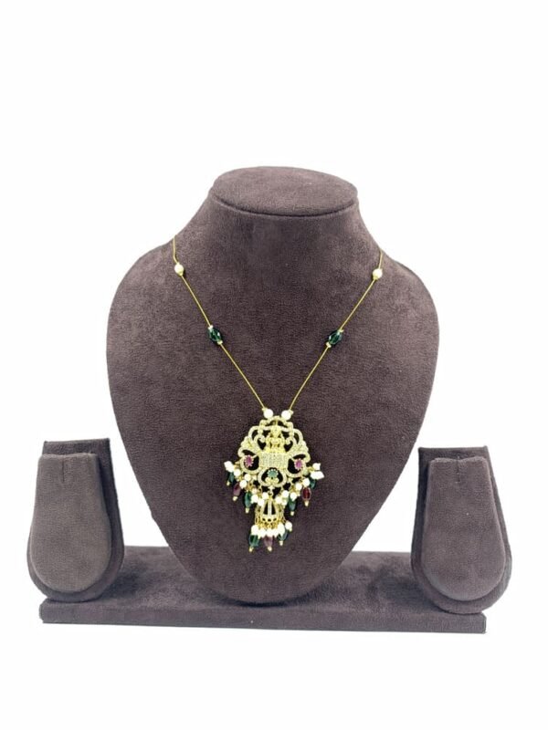 Gold-toned traditional pendant necklace with green beads and ornate central pendant