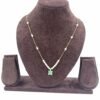 Invisible chain necklace featuring a mintgreen rectangular stone and delicate white beads