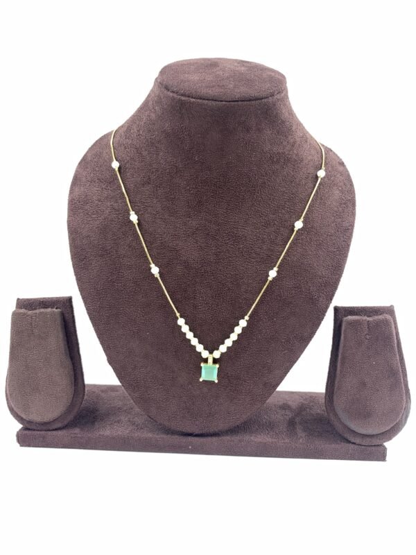 Invisible chain necklace featuring a mintgreen rectangular stone and delicate white beads