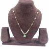 Invisible chain necklace featuring a mintgreen rectangular stone and delicate white beads