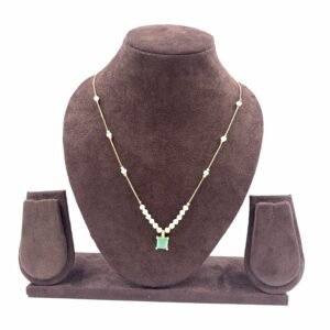 Invisible chain necklace featuring a mintgreen rectangular stone and delicate white beads